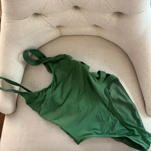 Green one piece bathing suit, hip hugger